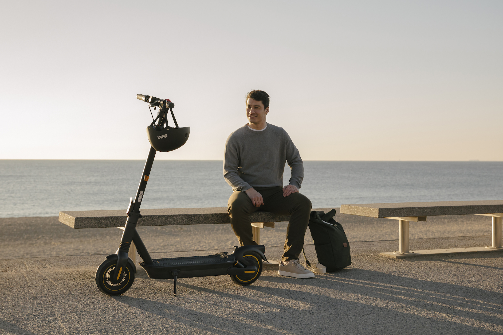 Ninebot KickScooter MAX G2_Lifestyle picture_Man sitting KickScooter standing